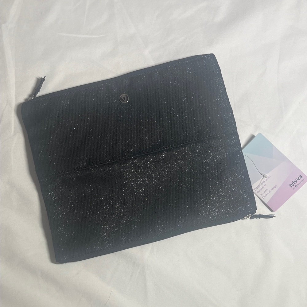 Ivivva reflective divide and stash organizer. Black Glitter Clutch
